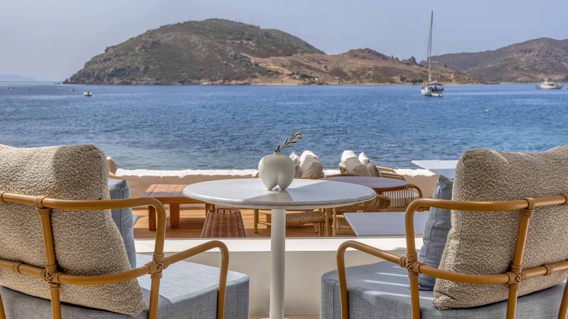 Image may contain: Furniture, Table, Dining Table, Tabletop, Chair, Nature, Outdoors, Scenery, Boat, and Transportation