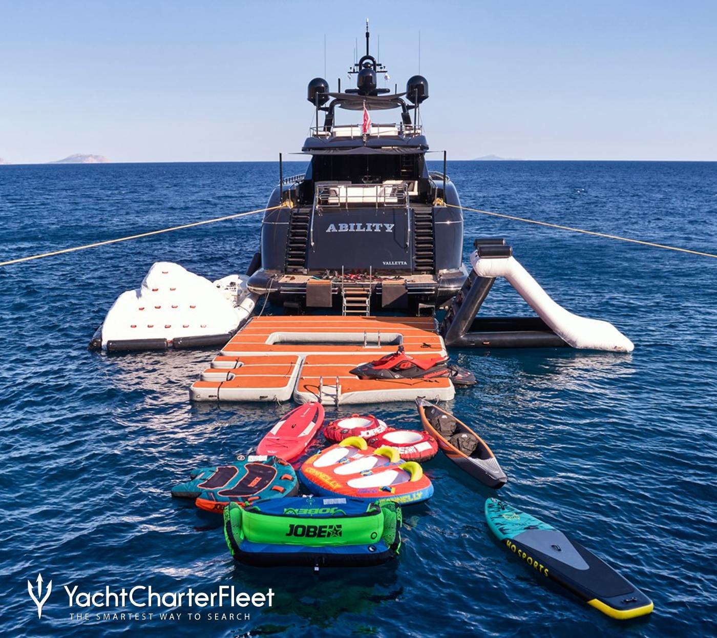 Charter yacht ABILITY at anchor with water toys