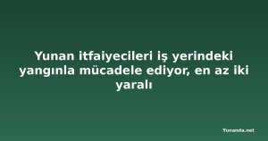 Yunan itfaiyecileri iş yerindeki yangınla mücadele ediyor, en az iki yaralı