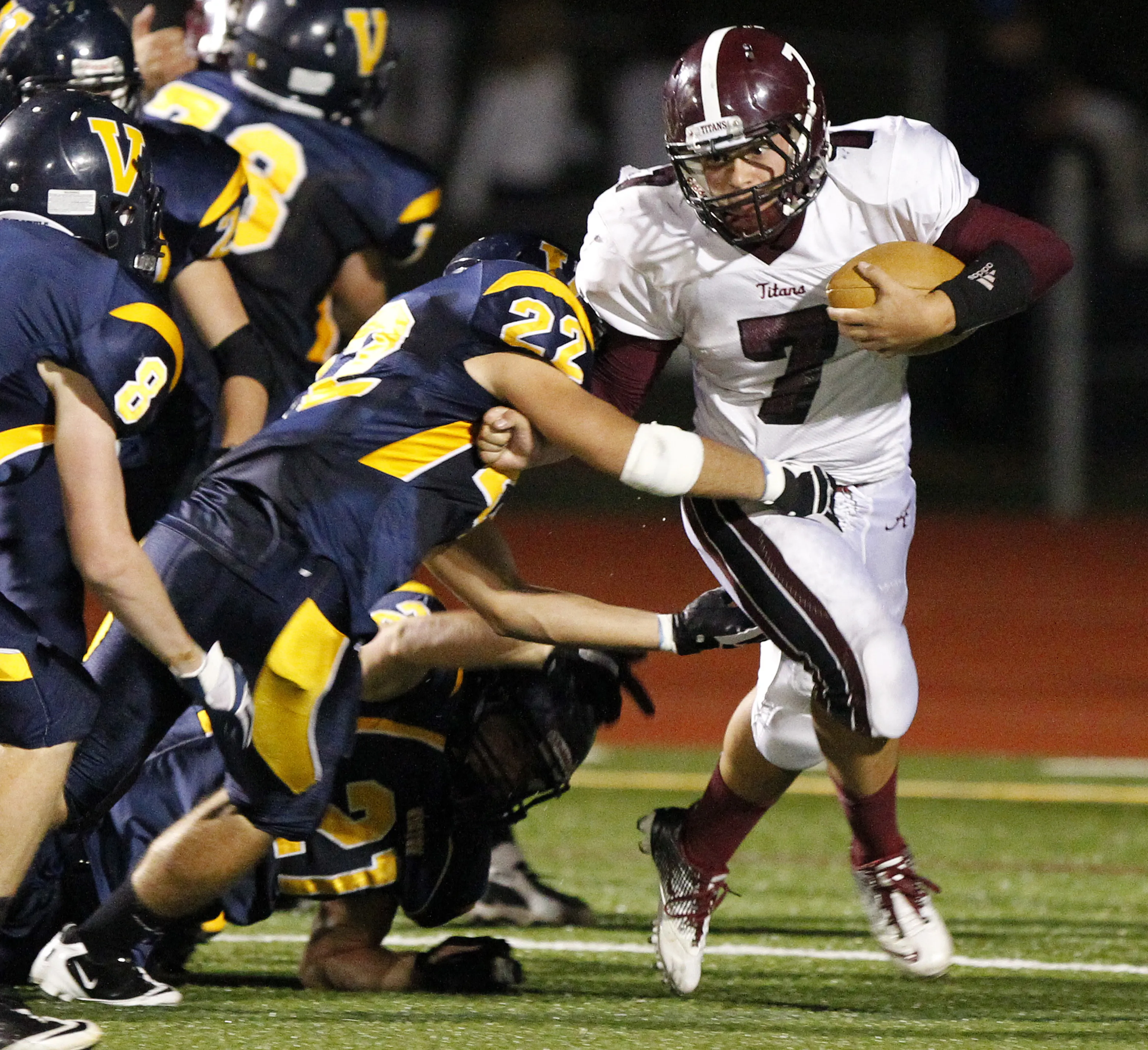 Greece Arcadia's David Ross, right, tries to shed Victor's Louie Sicilaino during a 2011 game at Victor.