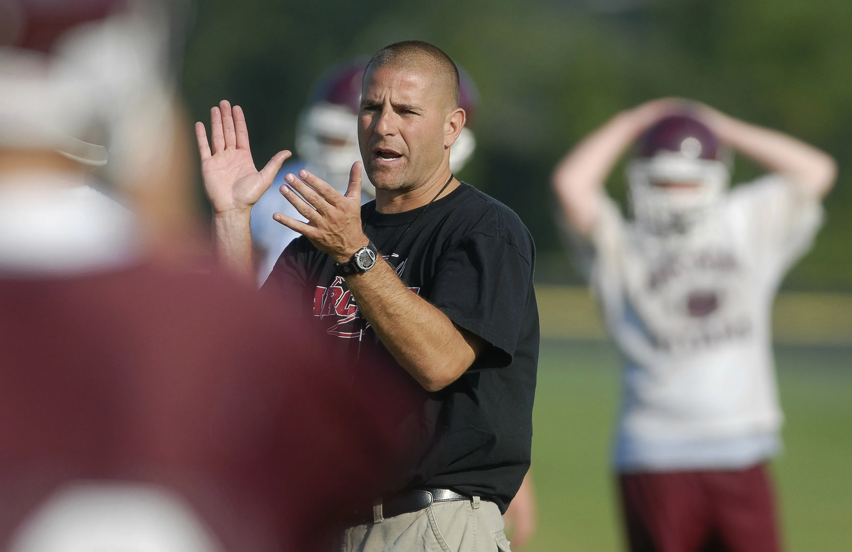 Greece Arcadia's head coach, John Lockhart coaches his team during football practice on Aug. 18, 2008.