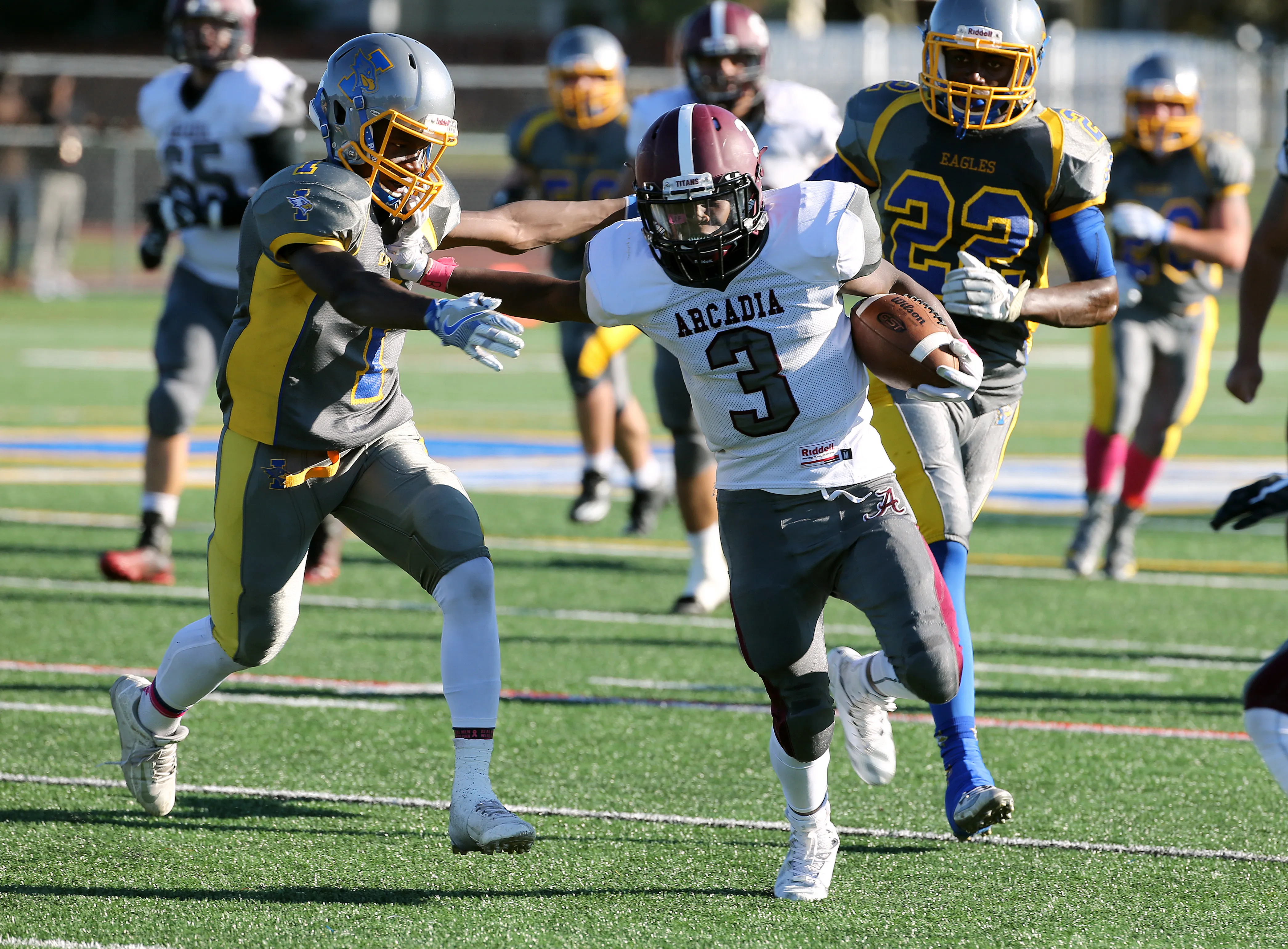 Greece Arcadia receiver Robert Smith looks for extra yards after a catch.