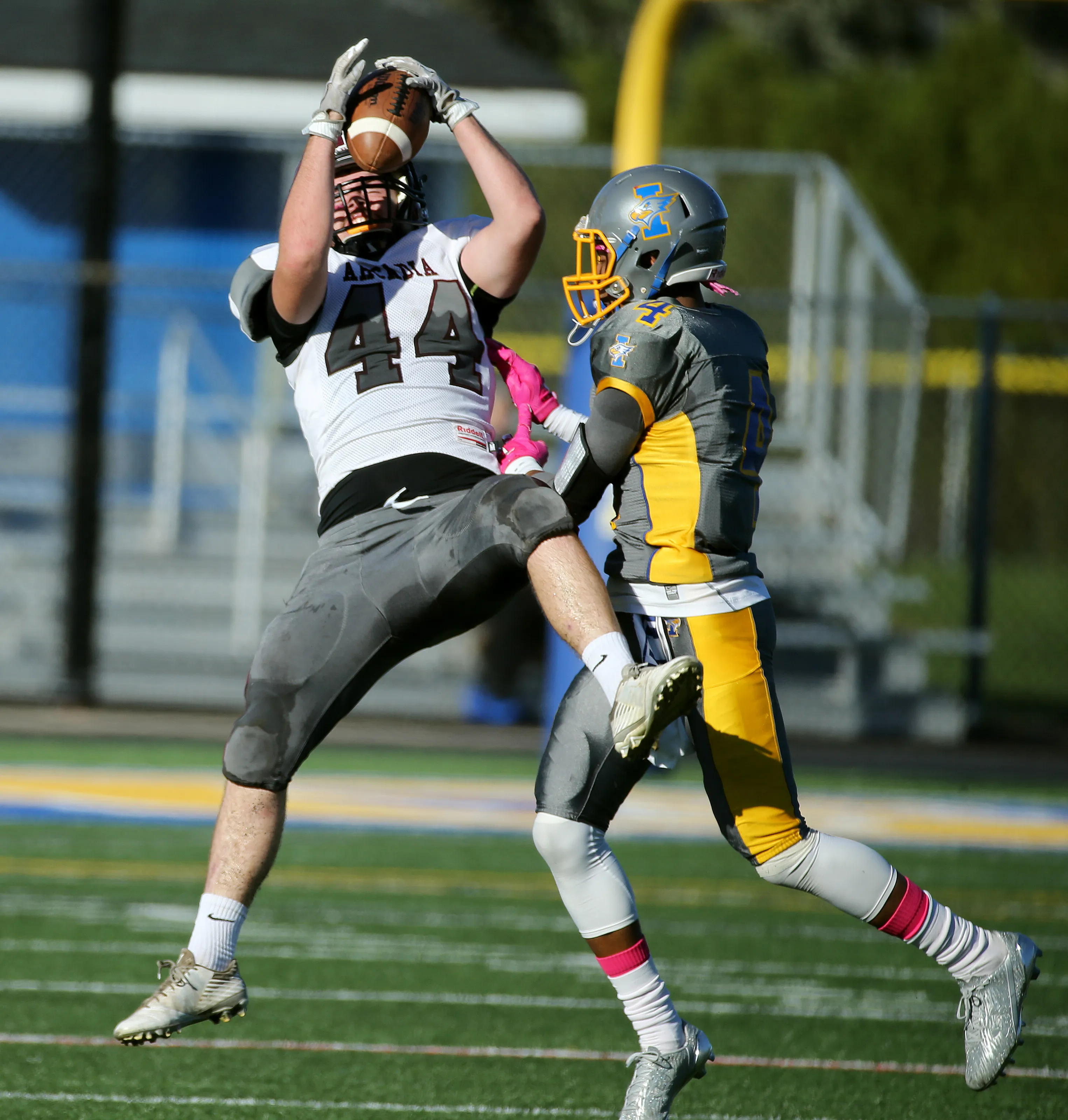 Greece Arcadia's Nick Toomey goes up for a catch against Irondequoit's Devyn Walker (4).