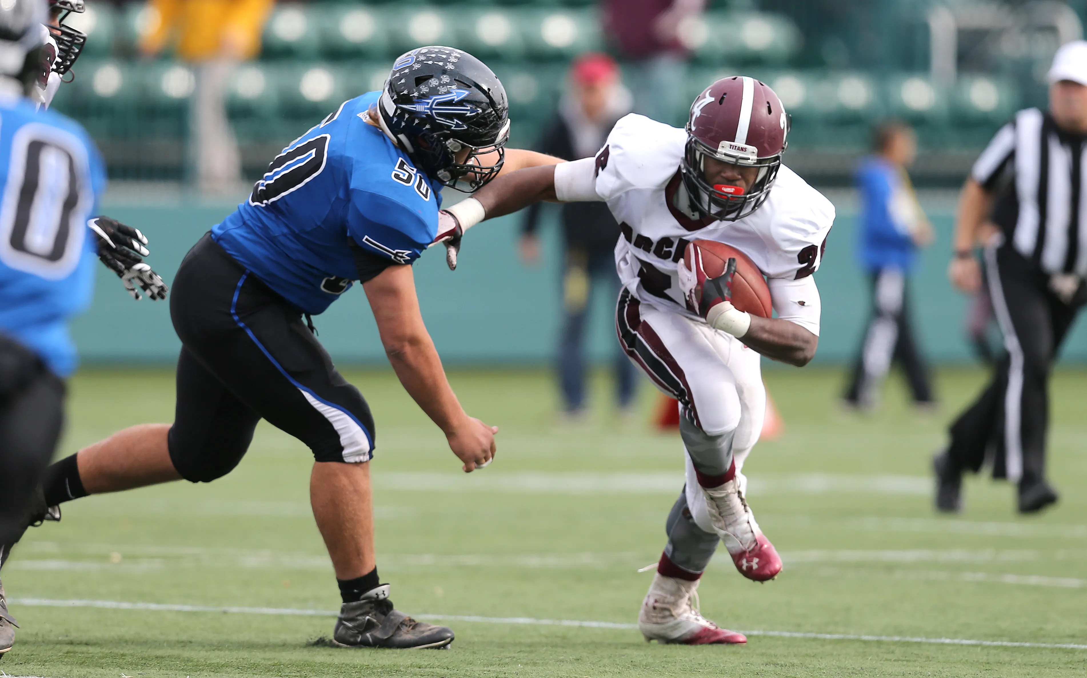 Brockport's Mike Mattison (50) closes in on Arcadia RB Cole Norris Jr.