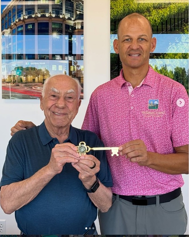 Angelos Tsakopoulos holding the key to the city with the Mayor of Sacramento